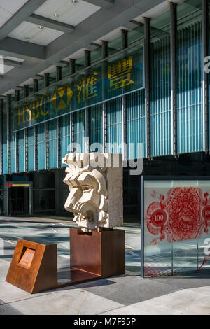 Giant Granite Lion Head Sculpture from 1930s guarding the Queen's Road Entrance to the HSBC Building, Hong Kong Stock Photo