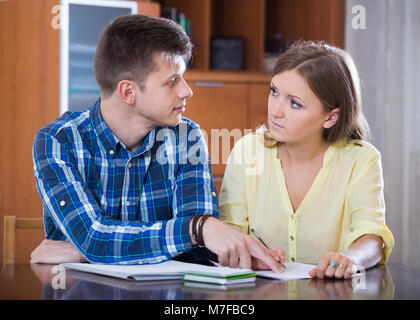 Two european collegues working with documents together in office Stock Photo