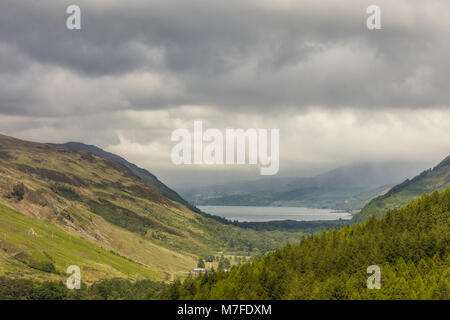 Braemore, Scotland - June 8, 2012: West of Corrieshalloch Gorge along A832 from height look upon Loch Broom under cloudy cloudscape. Green forested mo Stock Photo