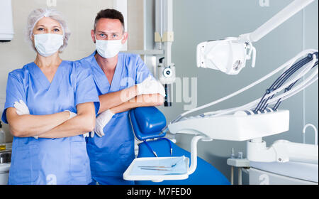 Portrait of two friendly professional dentists standing in modern medical office Stock Photo
