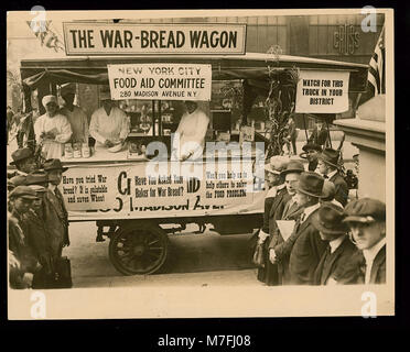A historical photograph showing a bread distribution point at the ...