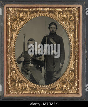 This image features two unidentified soldiers in Confederate uniforms ...