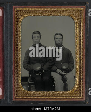This photograph shows two unidentified soldiers in Union uniforms ...