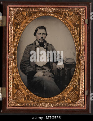 This photograph shows an unidentified Confederate soldier wearing a ...
