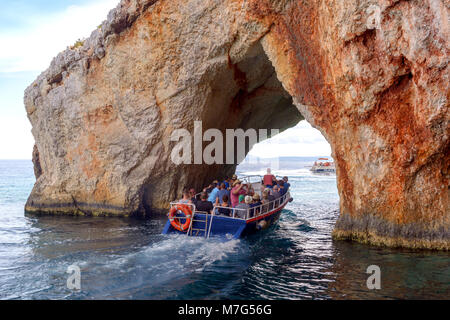 ZAKYNTHOS, GREECE- September 27, 2017: Tourists on excursion boat trip and Blue Caves of Zakynthos island, Greece Stock Photo