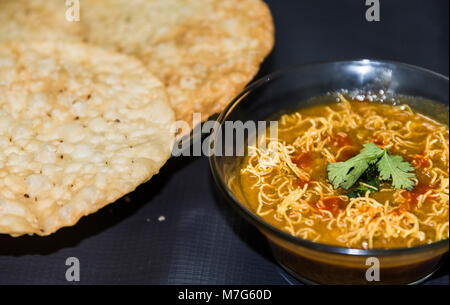 Dal Pakwan - The famous Sindhi cuisine- crispy deep fried flat bread with cooked spiced lentils (chanadal), mint chutney, tamarind-date chutney and on Stock Photo