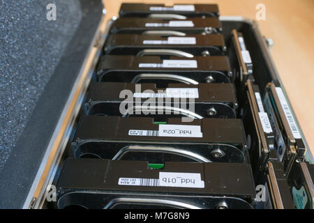 3.5 and 2.5 inch computer backup hard disks in an aluminium storage case. Stock Photo