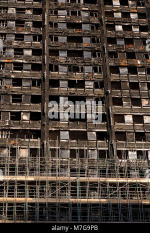 View of of burnt-out shell of Grenfell Tower housing with scaffolding, before demolition after fire disaster in London,UK Stock Photo