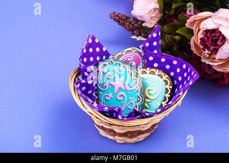 Easter eggs formed as tasty homemade cookies on bright background Stock Photo