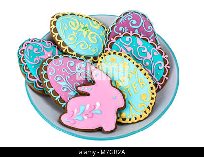 Easter homemade baked gingerbread cookies in the form of eggs with different pattern of icing on plate Stock Photo