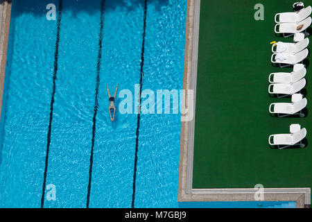 Aerial view of woman in swimming pool Stock Photo - Alamy