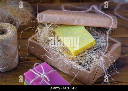 Handmade spa soap on old vintage wooden background. Soap making. Soap bars. Spa, skin care. Stock Photo