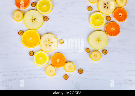 Colorful fresh fruit on white table. Orange, tangerine, lime, grapefruit. Fruit pattern. Summer food concept. Flat lay, top view Stock Photo