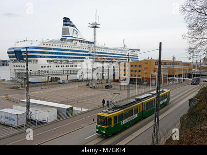 A tram passes the Stockholm ferry berth in Helsinki, Finland Stock Photo