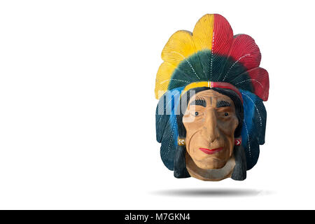 Plaster sculpture of red indian, native american people. Showing the tribe chief face and headdress full of eagle feather. For interior decoration. Stock Photo