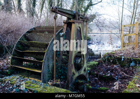 A disused water wheel in Panshanger Park in Hertfordshire, UK Stock Photo