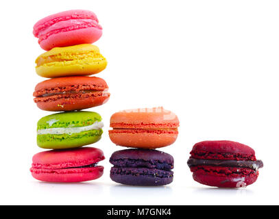 Multicolored macaroons cookies towers isolated on white background Stock Photo