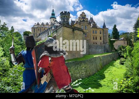 Medieval fighting knights in front of Gothic and Renaissance style castle in Frydlant, Czech Republic Stock Photo