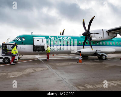 Stobart Air regional Irish airline ATR 72-600 twin propeller aircraft operating Aer Lingus Regional flights being loaded with passengers and baggage Stock Photo