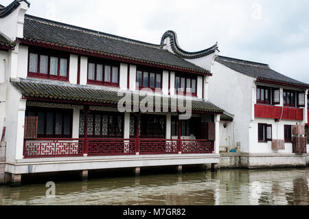 Classical Chinese architecture and buildings lining the water canals of Zhaojialou town in Shanghai China. Stock Photo