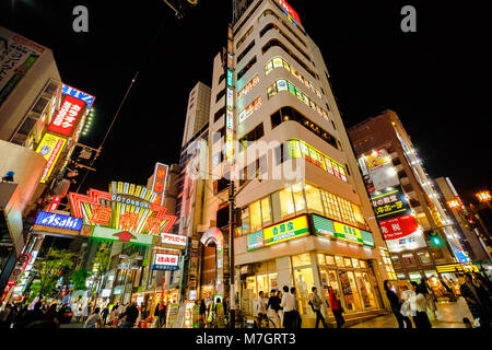 Osaka, Japan - April 29, 2017: bright neon of Dotonbori sign at entrance in Dotonbori street, Namba District. It is one of the principal tourist destinations in Osaka, Japan. Night scene. Stock Photo