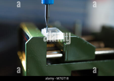 CNC milling machine processing plastic detail.Cutting plastic  modern processing Stock Photo