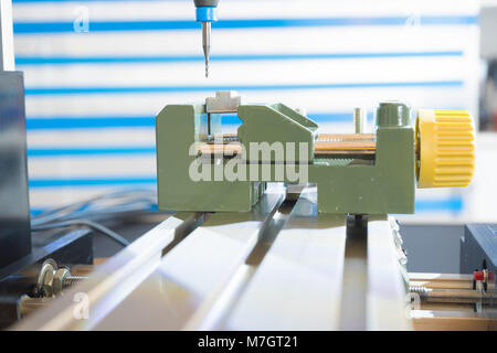 Processing of the plastic workpiece on CNC milling machine Stock Photo