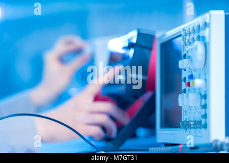 The use of measurement in the electronics laboratory Stock Photo