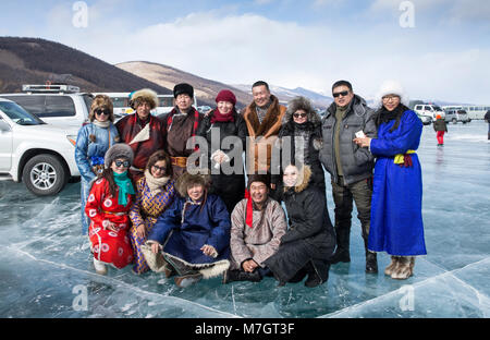 Mongolian people in traditional clothing on frozen lake Khovsgol Nuur Stock Photo