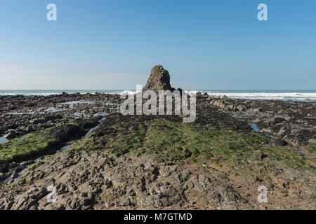 Black Rock and rock formations on beach at Widemouth Bay, North Cornwall Stock Photo