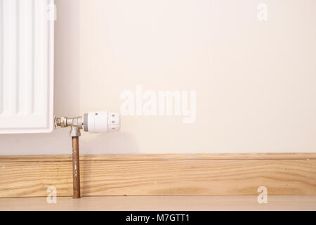 Thermostatic radiator valve angle lthw domestic heating circuit system at home Stock Photo