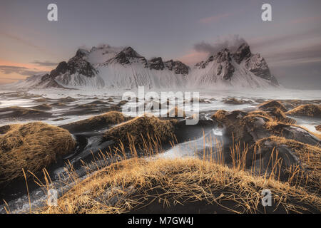 Black sand and Vestrahorn mountains at Stokksnes beach Stock Photo