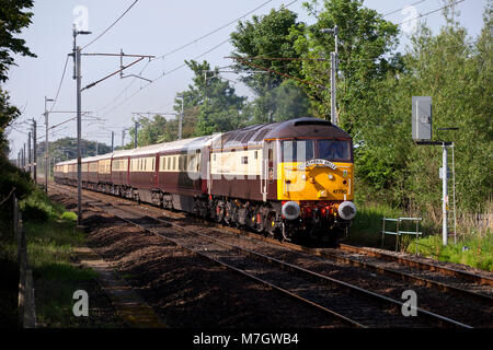 The Belmond Northern Belle luxury dining train heads north on the west coast main line at Bolton Le Sands hauled by a DRS class 47 locomotive Stock Photo