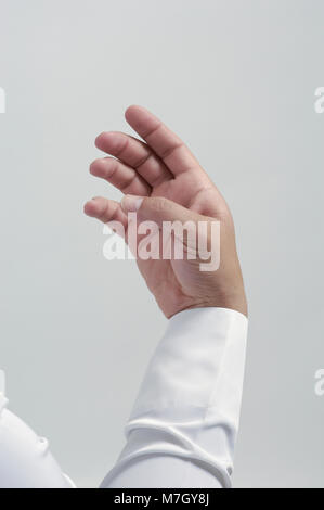 Empty Male Hand For Placing Mobile Phone or Other Object Isolated Close Up Stock Photo