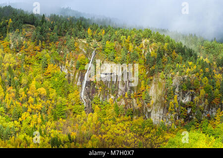 Seasonal waterfall in wild scenery of low mountain in Evje, central Norway. Stock Photo