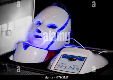 cosmetology led masks in a suitcase, light rejuvenating mask for facial skin therapy Stock Photo