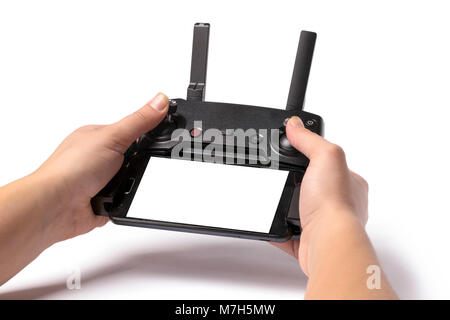 droning remote controller in hands, isolated on white background, with phone and place for text Stock Photo