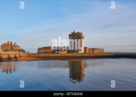 Broughty Castle and the Submarine Miners Living Range lit up in the Evening Sun at Broughty Ferry, Dundee in Angus, Scotland. Stock Photo