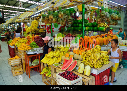 Mexican seller of fruits stand at a local market, Merida, Yucatan, Mexico Stock Photo