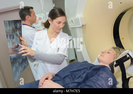 female doctor showing mri patient results Stock Photo
