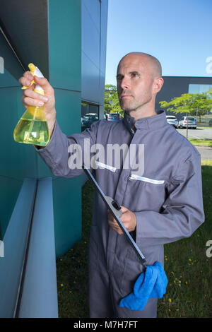 man cleaning windows Stock Photo