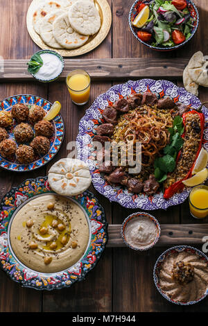 Middle eastern or arabic dishes and assorted meze on a dark background