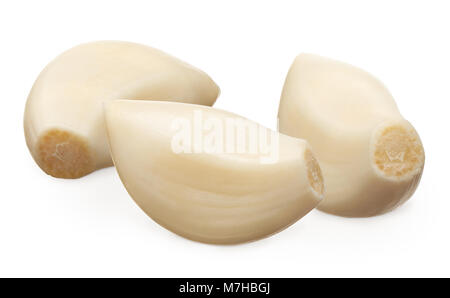 Three peeled cloves of garlic isolated on white background Stock Photo