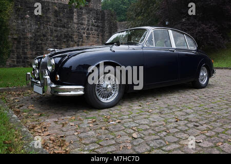 Vintage black Jaguar automobile parked at Hirschhorn castle ruins, Hessen, Germany Stock Photo