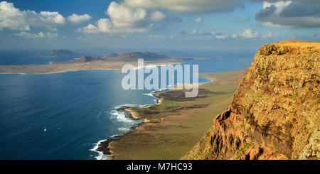 Isla Graciosa, part of the Chinijo Archipelago, seen from near Guinate, Lanzarote, Canary Islands, Spain.  Panoramic. Stock Photo