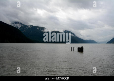 The remains of an old pier in the Portland Canal separating Canada (left) and the United States, at Hyder, Alaska and Stewart, British Columbia. Stock Photo