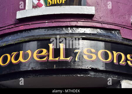 Sign of musical instruments and entertainment shop Powell and Sons The Four Corners in Galway. Stock Photo