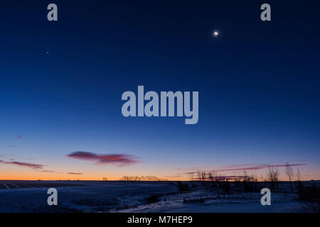 Venus and Jupiter in close conjunction very low in the southeast sky, Alberta, Canada. Stock Photo