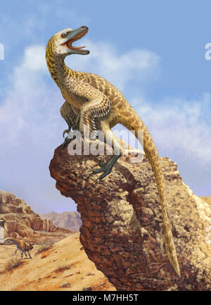 A Velociraptor screams loudly while perched on top of a rock formation. Stock Photo