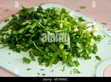 Sliced green onion on the cutting board Stock Photo